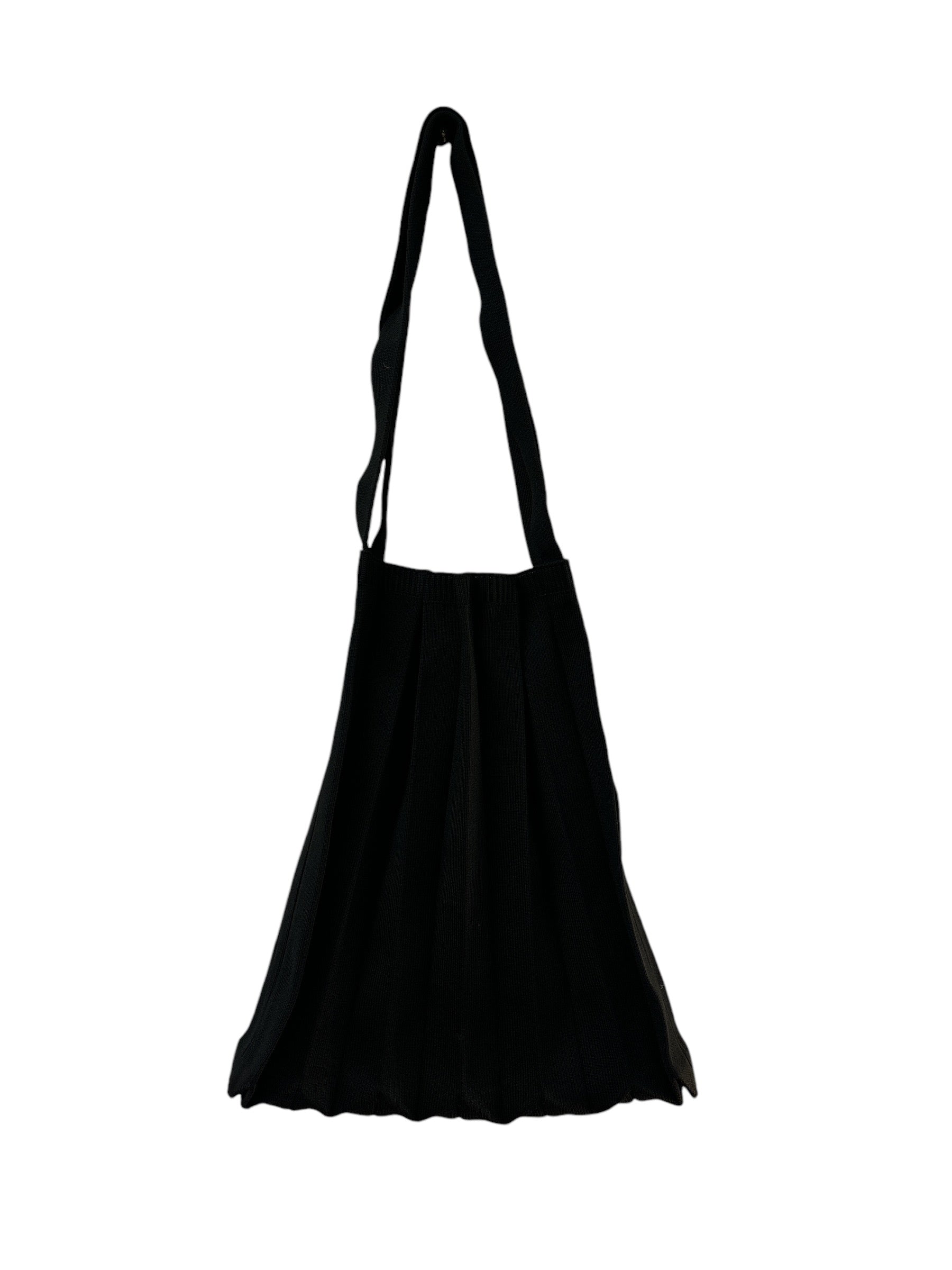 Abanica Tote in Black, featuring pleating detail, arm straps, and spacious interior. Perfect for city life and personalized styling.