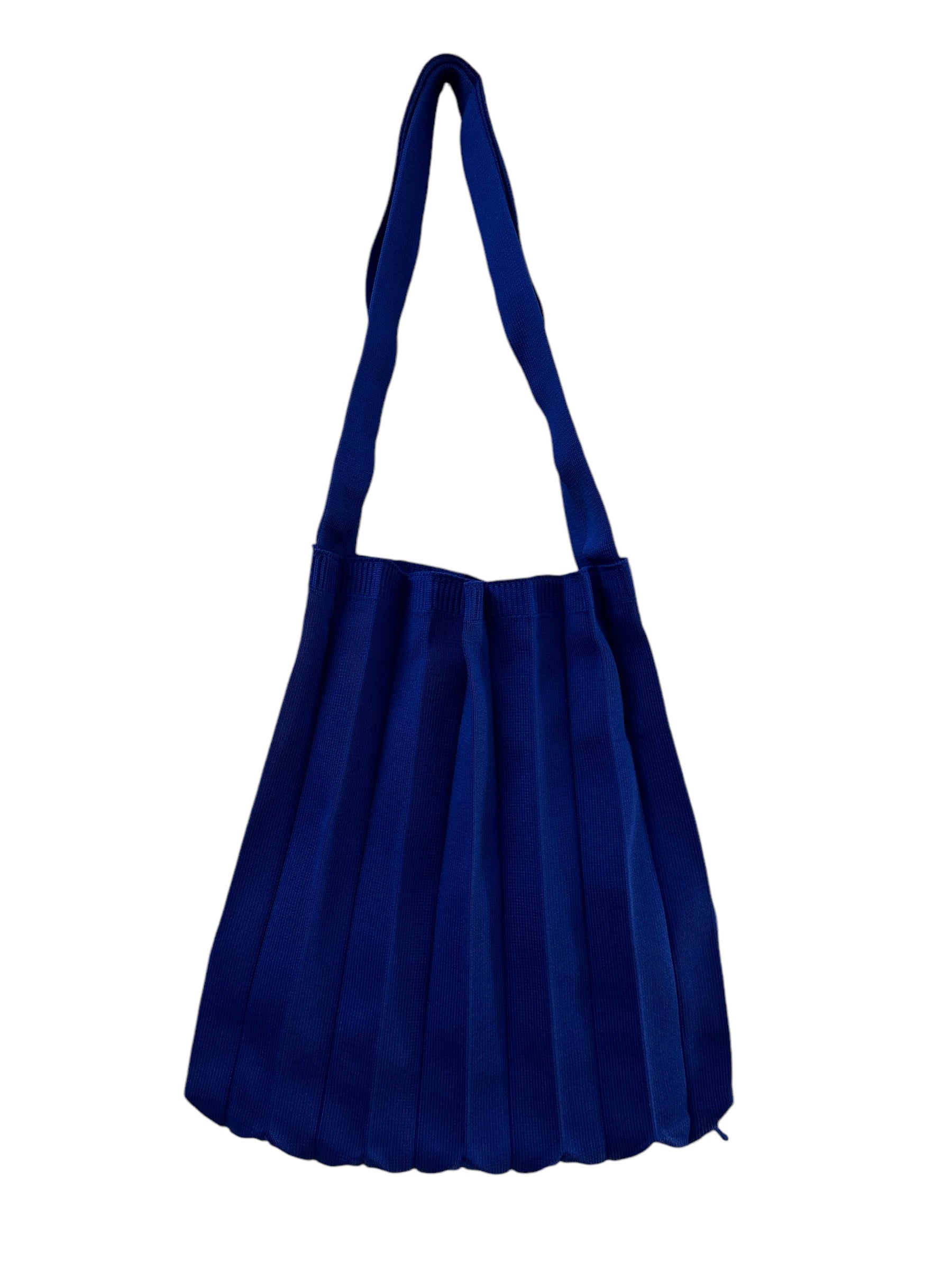 Abanica Tote in Blue, showcasing pleating details, arm straps, and a spacious interior for a chic, functional accessory.