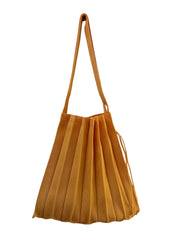 Abanica Tote in spring colors with unique fan-inspired pleats and two arm straps, perfect for personalizing with brooches or clips.