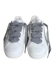 Close-up of black Vichy checkered laces highlighting the bold gingham pattern