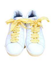 Close-up of yellow Vichy checkered laces highlighting the bold gingham pattern
