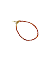Delicate amber bracelet with semi-precious golden stones and a gold-plated stainless steel clasp.