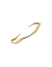 Gold-finished stainless steel cuff bracelet with sleek, fluid curves, offering minimalist elegance.
