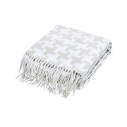 Houndstooth throw with fringed edges, made from a soft cotton and polyester blend, perfect for sofas and beds.