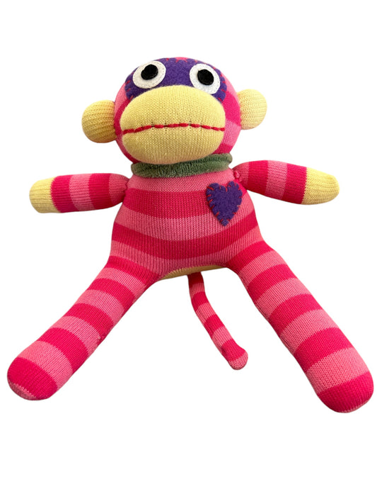 small cuddly sock monkey toy in pink stripes