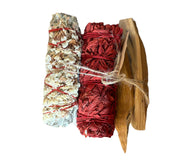 KITI cleansing set with White Sage, Dragon's Blood, Palo Santo, and Evil Eye charm for protection and balance.