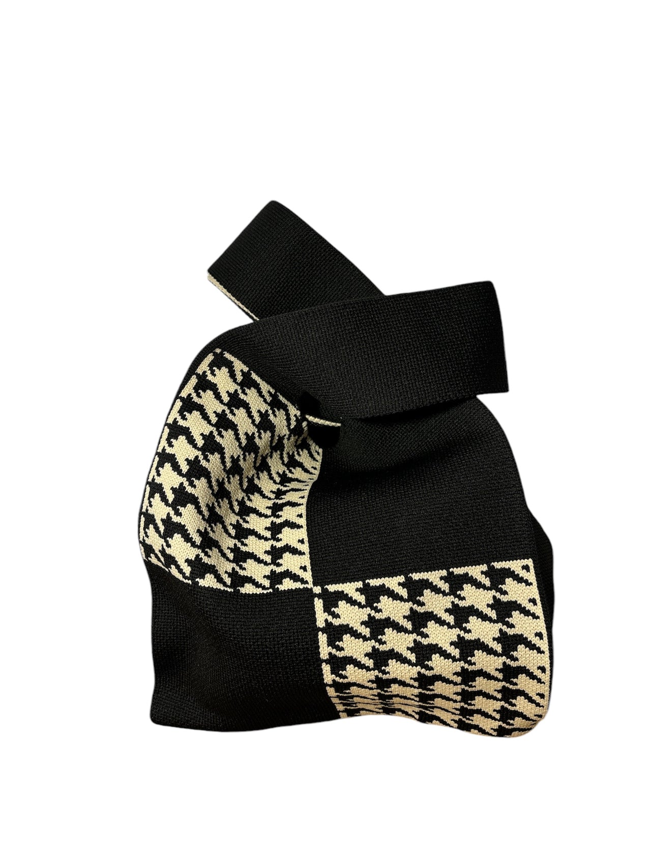 Knit handbag with houndstooth pattern, compact yet spacious, perfect for everyday wear.