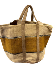 Natural jute basket with sturdy handles, ideal for home storage and organization. Spacious and stylish with an earthy, minimalist design.