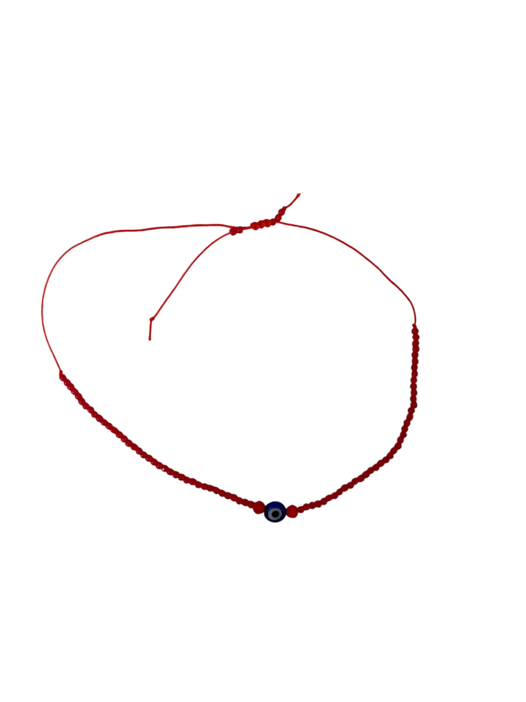 Red Seed Bead Evil Eye Bracelet with delicate red beads and protective evil eye charm, symbolizing love and protection, featuring an adjustable sliding knot closure.