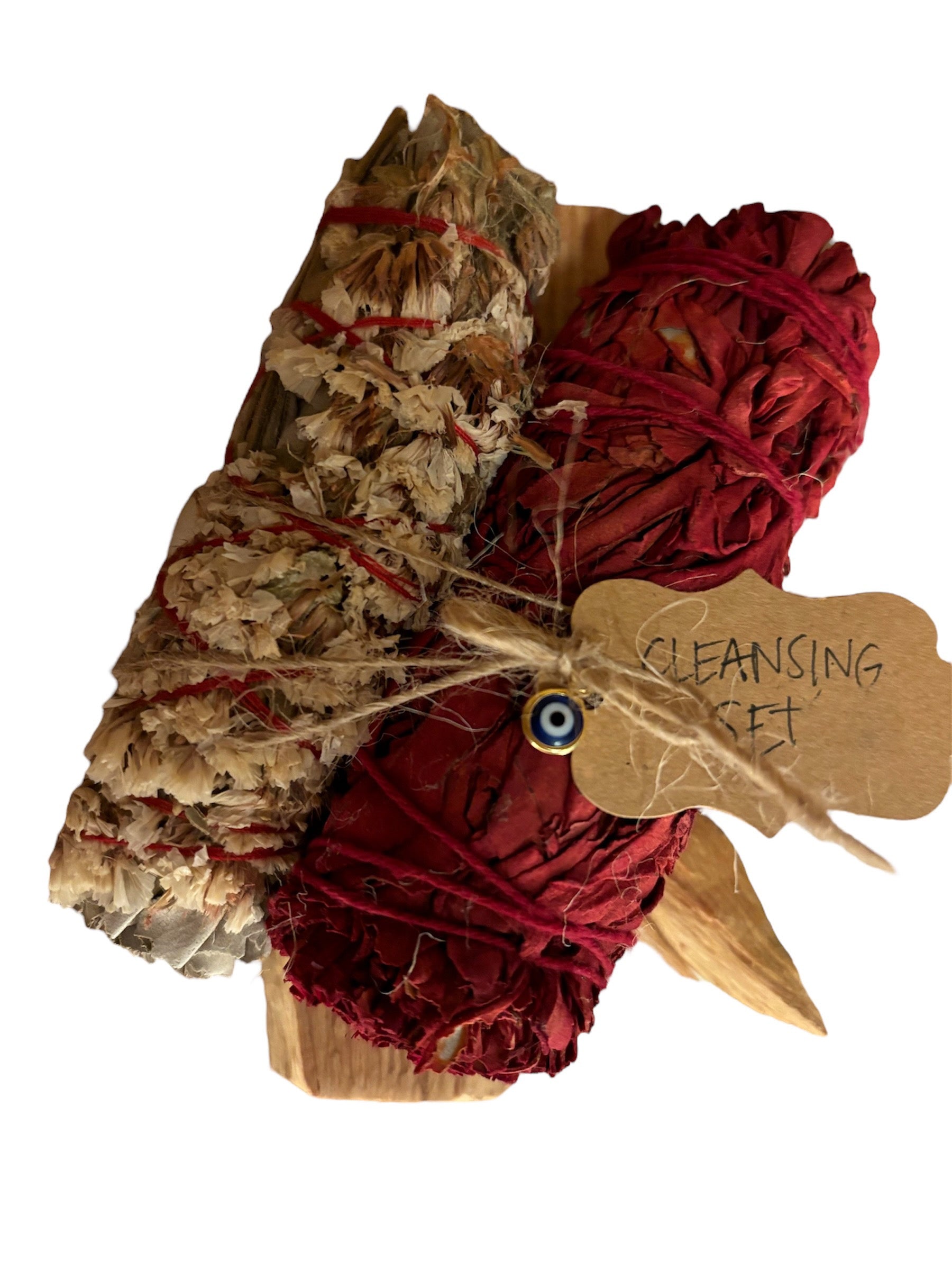 KITI cleansing set with White Sage, Dragon's Blood, Palo Santo, and Evil Eye charm for protection and balance.