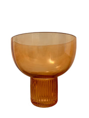 Rose-Colored Glass Vase with ribbed stem and wide opening, perfect for floral arrangements and adding a stylish pop of color to any room.