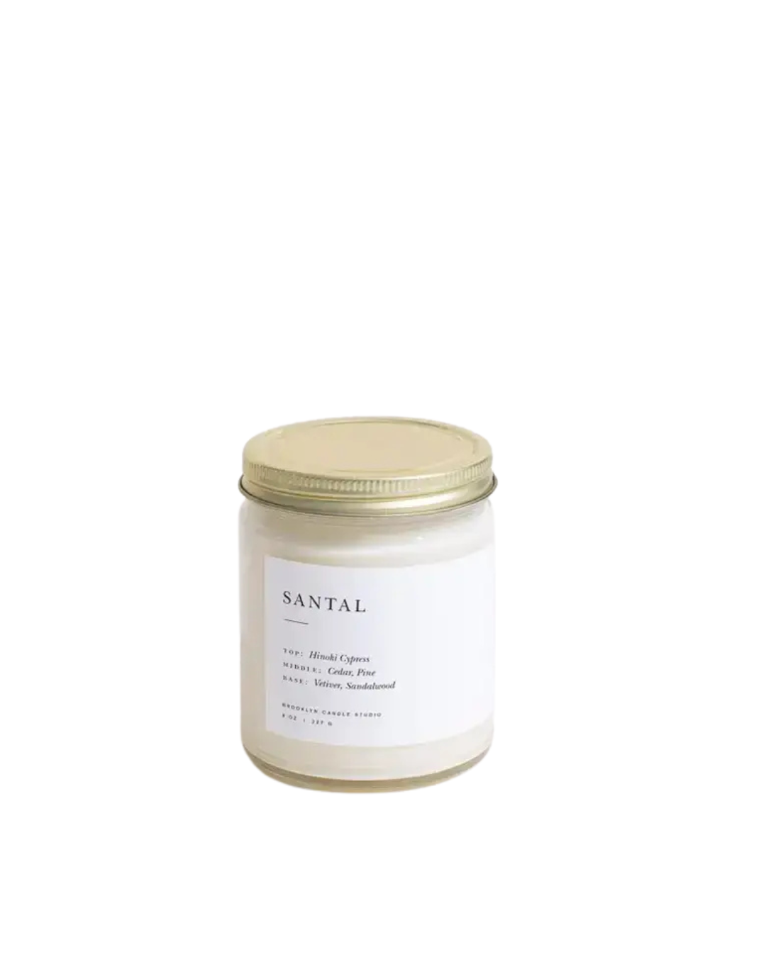 Santal Minimalist Candle by Brooklyn Candle Studio in a clear glass jar with minimalist label, featuring a rich blend of Hinoki Cypress, cedar, pine, vetiver, and sandalwood.