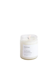 Santal Minimalist Candle by Brooklyn Candle Studio in a clear glass jar with minimalist label, featuring a rich blend of Hinoki Cypress, cedar, pine, vetiver, and sandalwood.