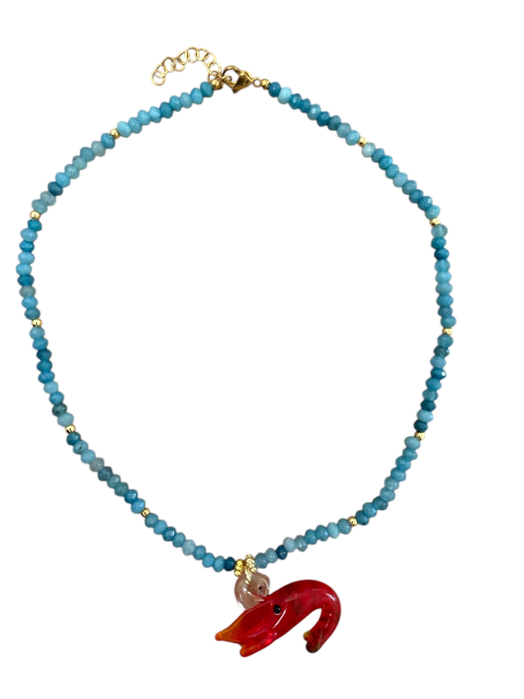 Handmade necklace with colorful crystal beads and a whimsical glass sea creature charm.