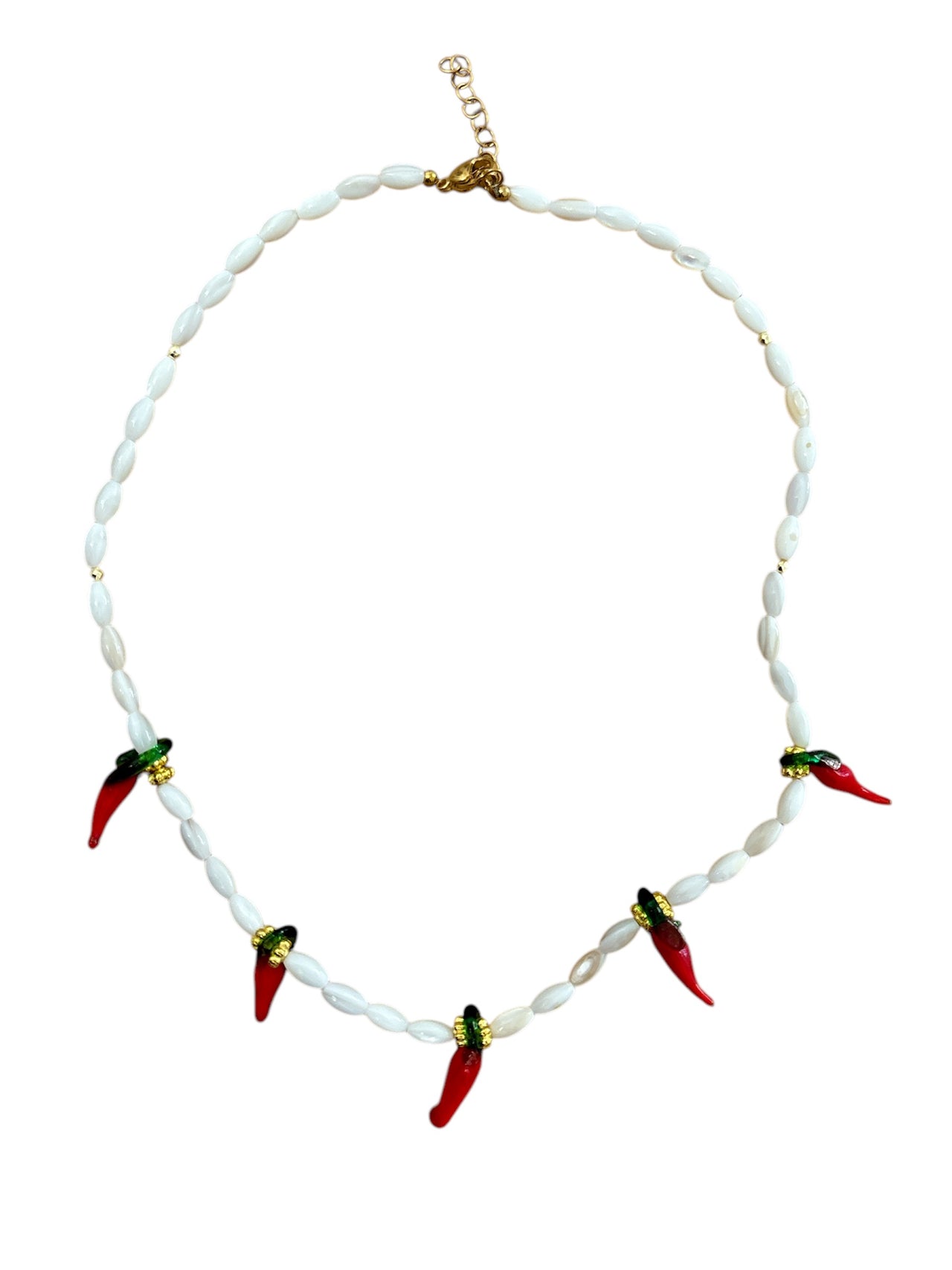 Handmade necklace with smooth mother-of-pearl beads and bold glass chili pepper charms. Adjustable up to 41cm with a secure clasp closure. A playful, spicy accessory.